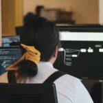 woman in white long sleeve shirt