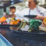green vegetable on black ceramic plate