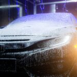 a car is covered in ice and water