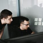man in black tank top wearing eyeglasses