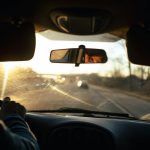 a person driving a car on a highway