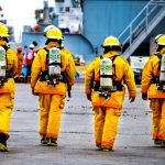 four yellow fire fighters