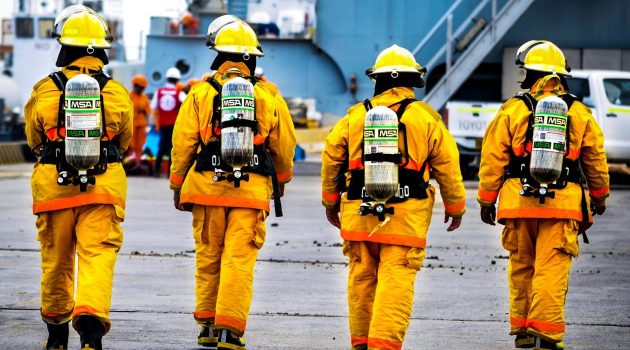 four yellow fire fighters