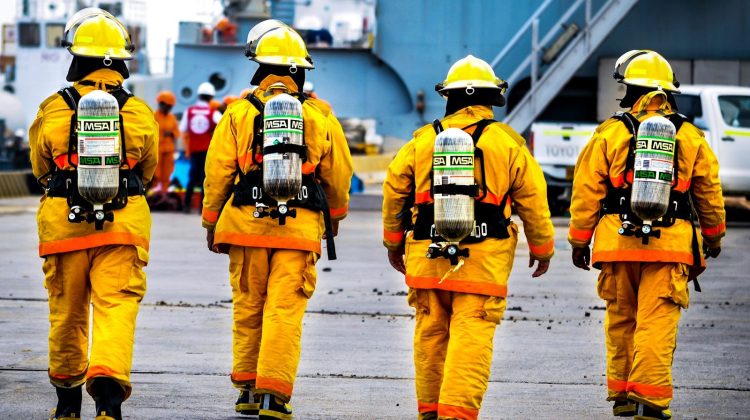 four yellow fire fighters